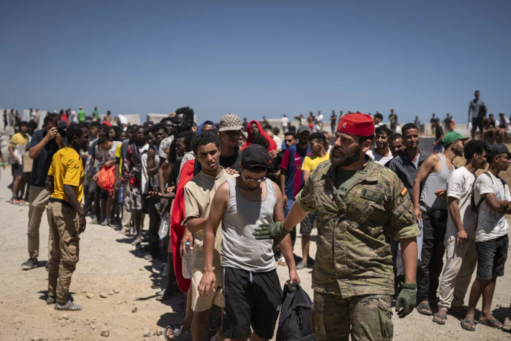 Migrants in Ceuta waiting for water