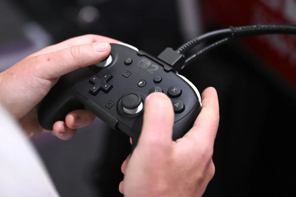 Gamer with controller at a Nintendo Switch booth